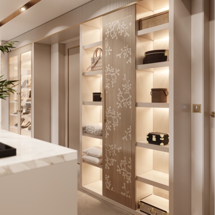 Custom Blossom Closet with walnut veneer, LED-lit shelving, and brass handles by Lapa Interior Design